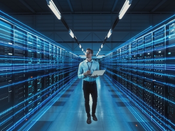 A Data Center manager walks an AI data center with fiber cabling
